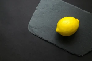 Photo of Yellow Lemon on Gray Surface